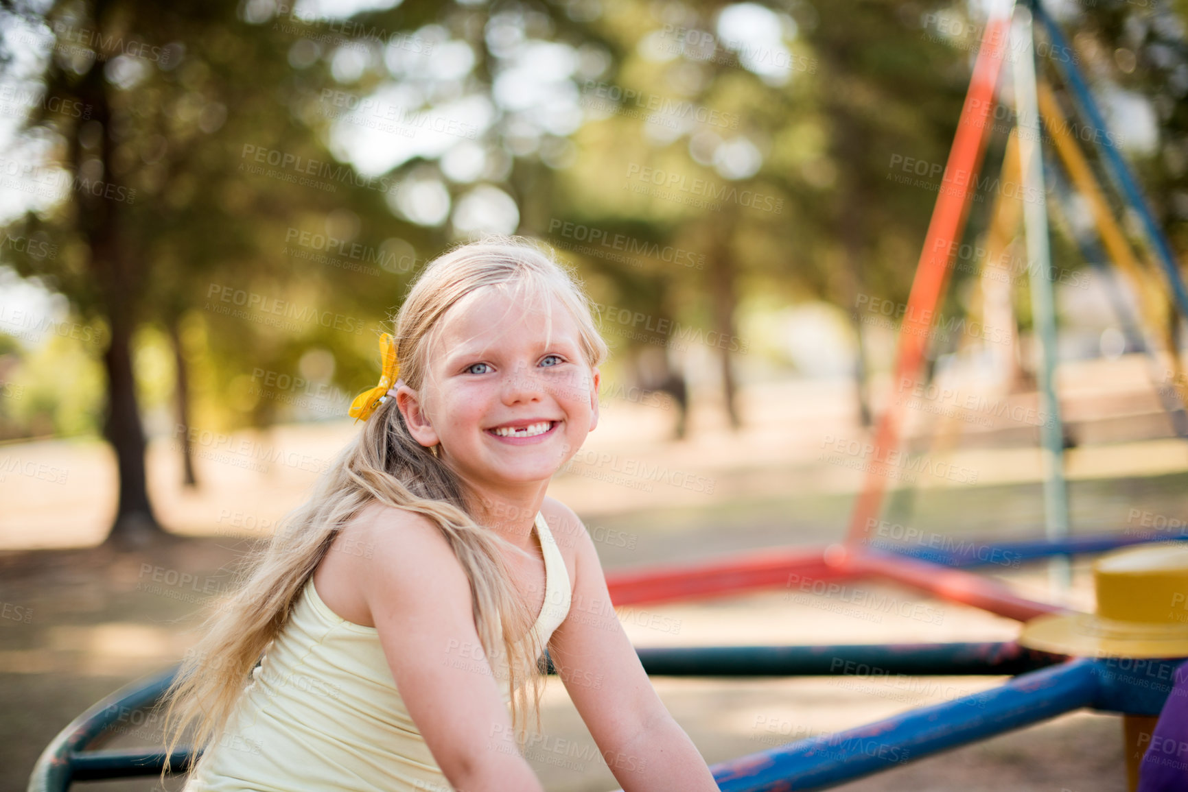 Buy stock photo Fun, playground and youth with girl in park for growth, adventure and merry go round games. Cute, happiness and kindergarten child playing outdoors for exercise, balance and smile on summer holiday