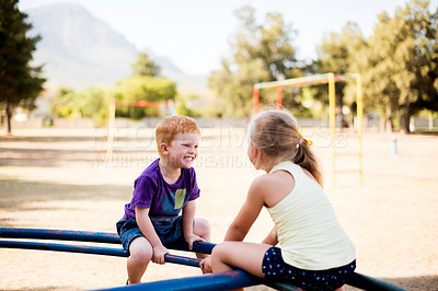 Buy stock photo Smile, children and play on merry go round at park for summer fun, obstacle course and bonding together. Kids, ride and playground equipment with fine motor skills, active entertainment and childhood