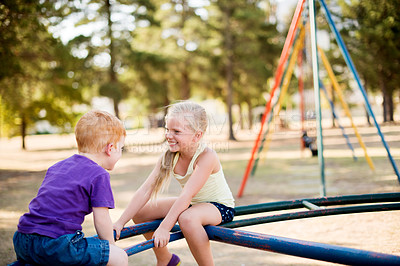Buy stock photo Happy, children and play on merry go round at park for summer fun, obstacle course and bonding together. Kids, ride and playground equipment with fine motor skills, active entertainment and childhood