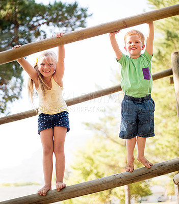 Buy stock photo Portrait, children and outdoor playground with equipment, adventure and playful exercise. Smile, boy and girl with fun games with motor growth, balance and family support for childhood activity
