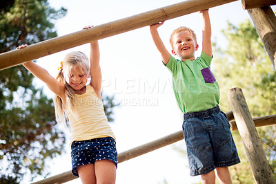 Buy stock photo Smile, children and outdoor playground with equipment, adventure and playful exercise. Happy, boy and girl with fun games for jungle gym, balance and family support for holiday childhood activity