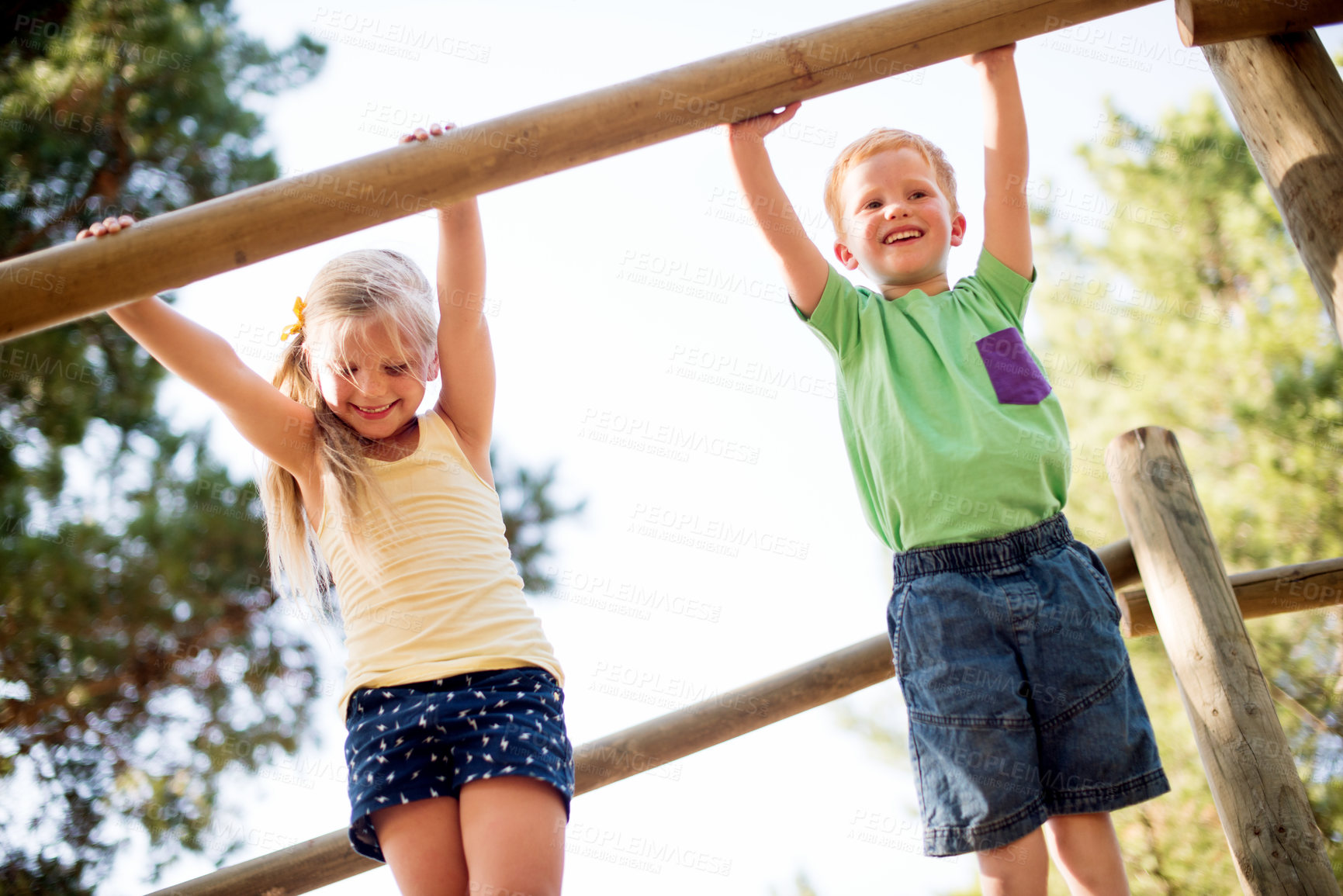 Buy stock photo Smile, children and outdoor playground with equipment, adventure and playful exercise. Happy, boy and girl with fun games for jungle gym, balance and family support for holiday childhood activity