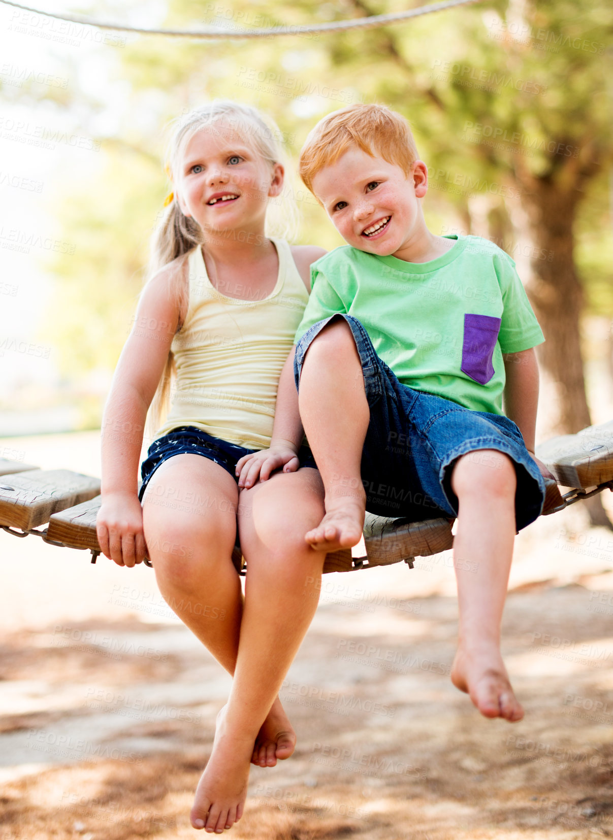 Buy stock photo Family, happy and children hugging in park for bonding, connection or adventure together. Love, siblings and kids embracing outdoor on playground for development, growth and exploring in nature.