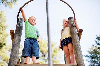 Buy stock photo Smile, playground and games with kids in park for growth, adventure and climbing. Low angle, happiness and kindergarten children playing outdoors for exercise, balance and  fun on summer holiday
