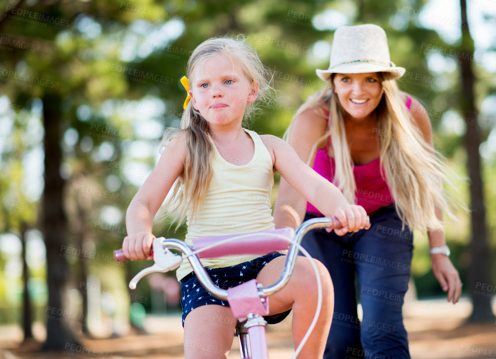 Buy stock photo Mom, girl and teaching with bicycle in park with love, bonding or happy in woods on holiday. Woman, child and learning, cycling and bike on outdoor adventure, forest or vacation trail in nature