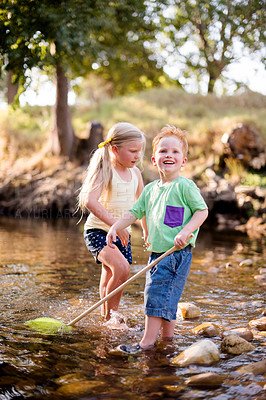 Buy stock photo Development, fishing and happy kids with net at river in nature together for bonding, curiosity or growth. Family, smile or travel with boy and girl children in water for adventure or discovery