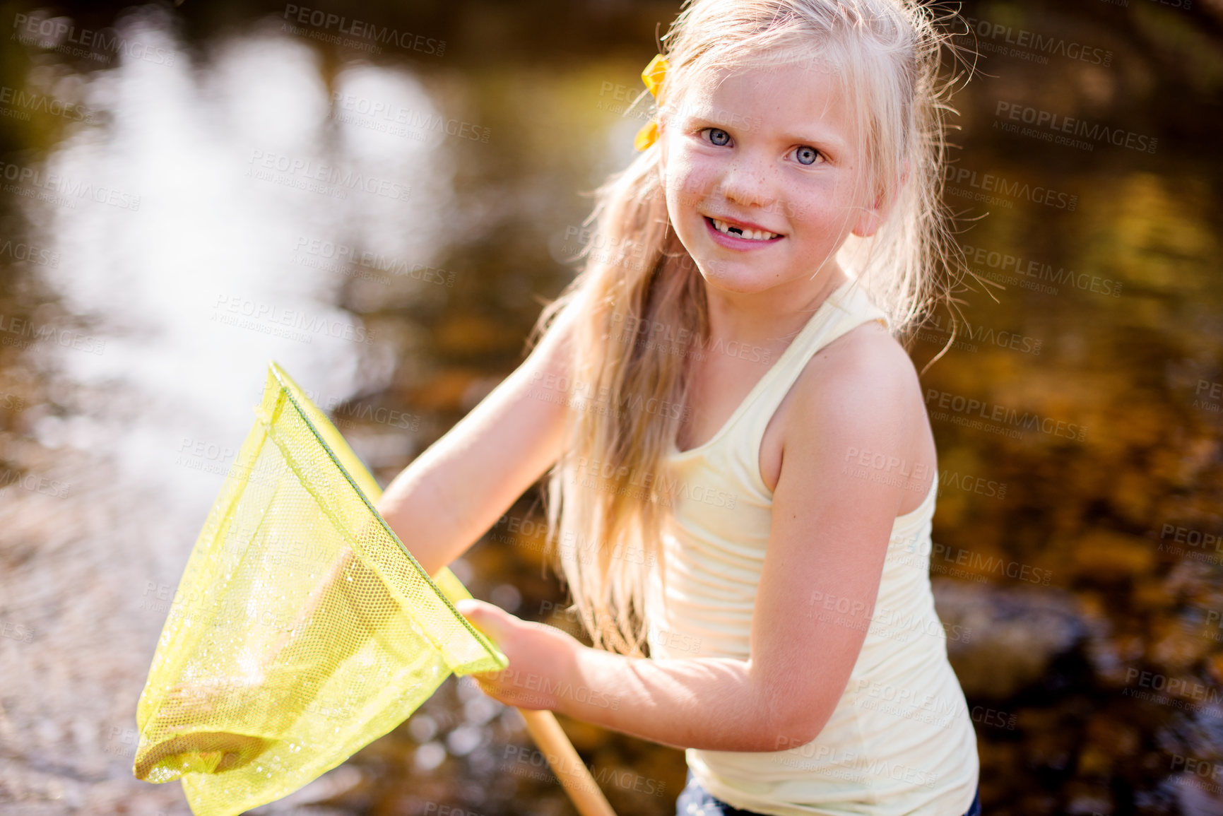 Buy stock photo Kid, portrait and play with fishing net on vacation, holiday and adventure in countryside. Face, catch and happy girl in river with equipment for learning, hobby or hiking to travel in Switzerland