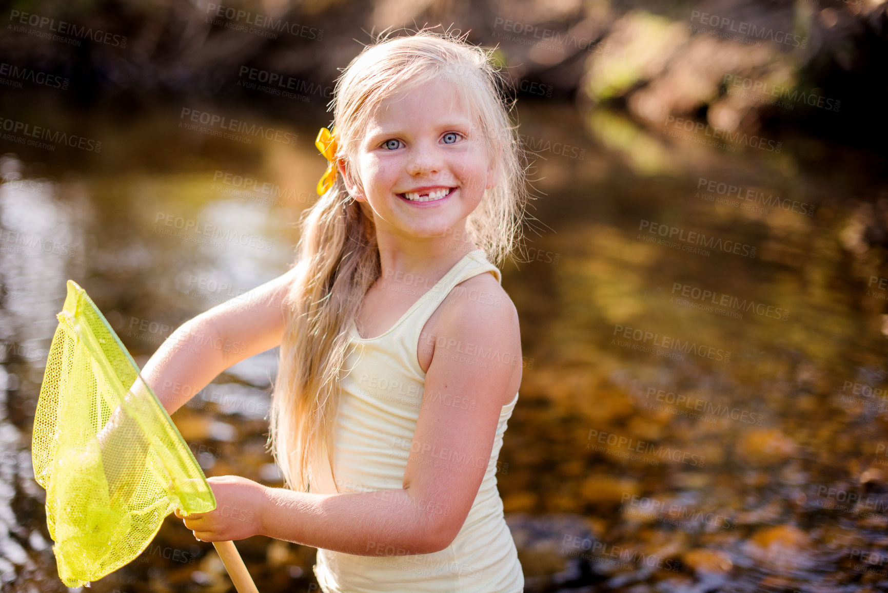 Buy stock photo Child, portrait and play with fishing net on vacation, holiday and adventure in countryside. Face, catch and happy girl in river with equipment for learning, hobby or travel by water in Switzerland
