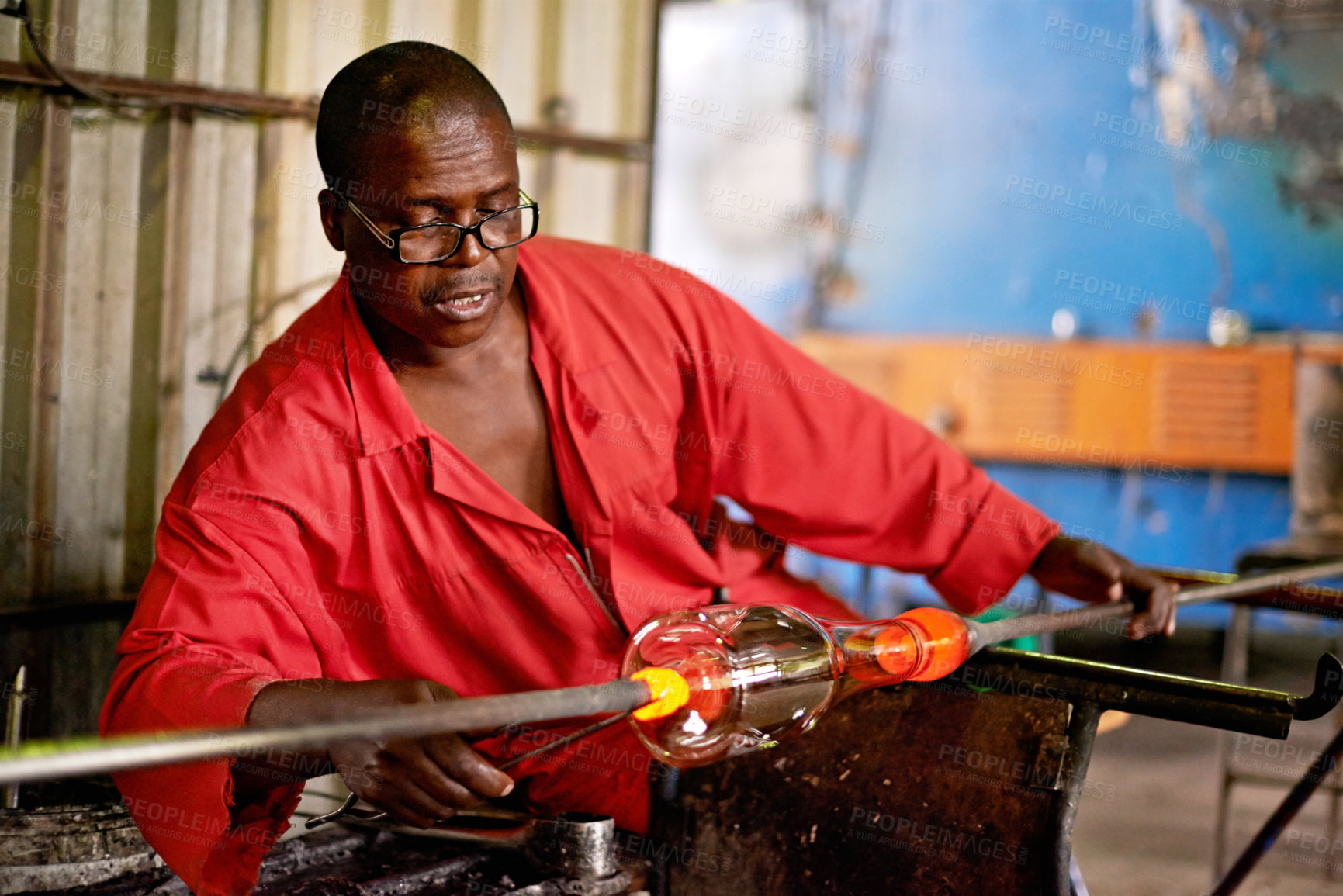Buy stock photo Glass, art and black man in craft workshop for small business with heat, tools and technique. Creative, handmade product and glassblower in factory for sustainable process, design or bottle sculpture