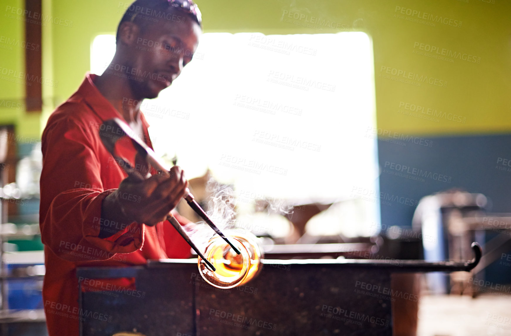Buy stock photo Glass, art and black man in workshop for small business with heat, tools or craft technique. Creative, handmade product or glassblower in factory for sustainable process, design or bottle sculpture