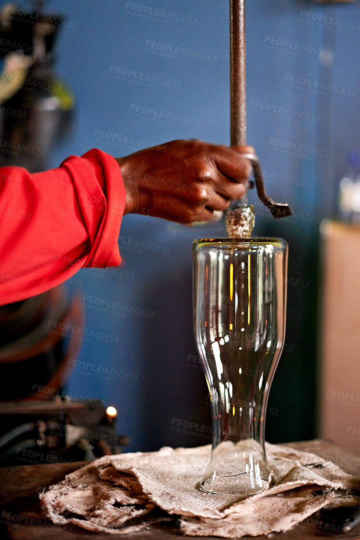 Buy stock photo Hands, glassblower and man in workshop, product and process with craftsmanship. Closeup, person and employee in foundry, equipment and skills with vase, materials and manufacturing with industry