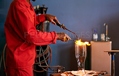 Buy stock photo Glassblowing, heat and man with blowtorch, shaping and creative for manufacturing of glass and industry. Production, busy and person in uniform for craft, glassmakers and art for design of product