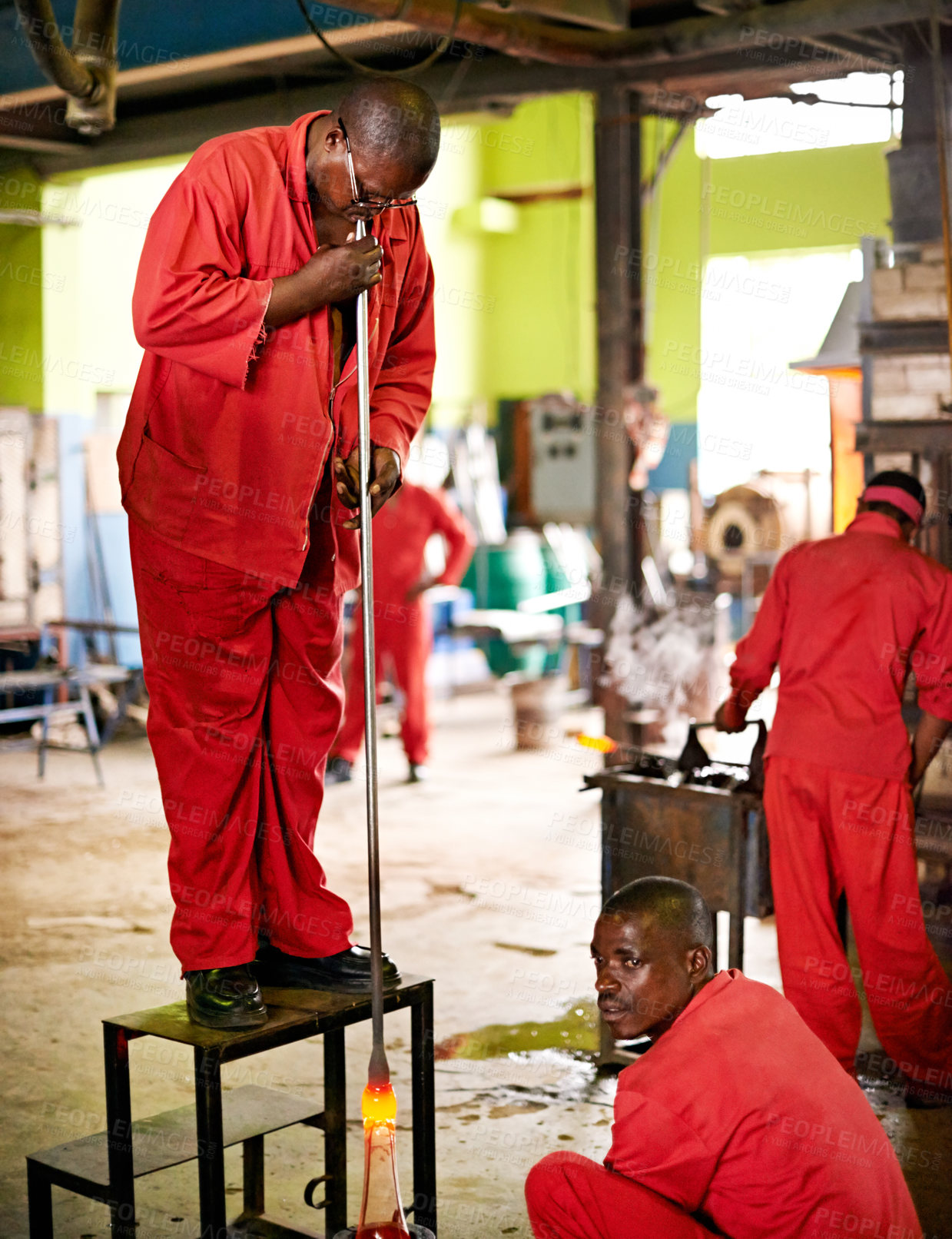 Buy stock photo Glass, blow and people in factory for heating production and equipment for professional craft skills. Labor, workshop and shaping object with tools for metalwork, manufacturing and forge for teamwork