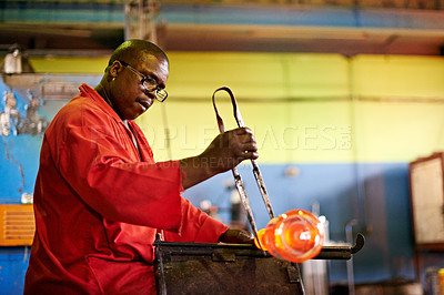 Buy stock photo Glass, craft and black man in workshop with tools for small business, art or handmade technique. Creative, product shape or glassblower in factory for sustainable process, design or bottle sculpture