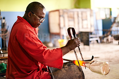Buy stock photo Glass, blowing and black man in bottle workshop for small business, craft or handmade technique. Creative, product shape or glassblower in factory for sustainable process, design or sculpture art