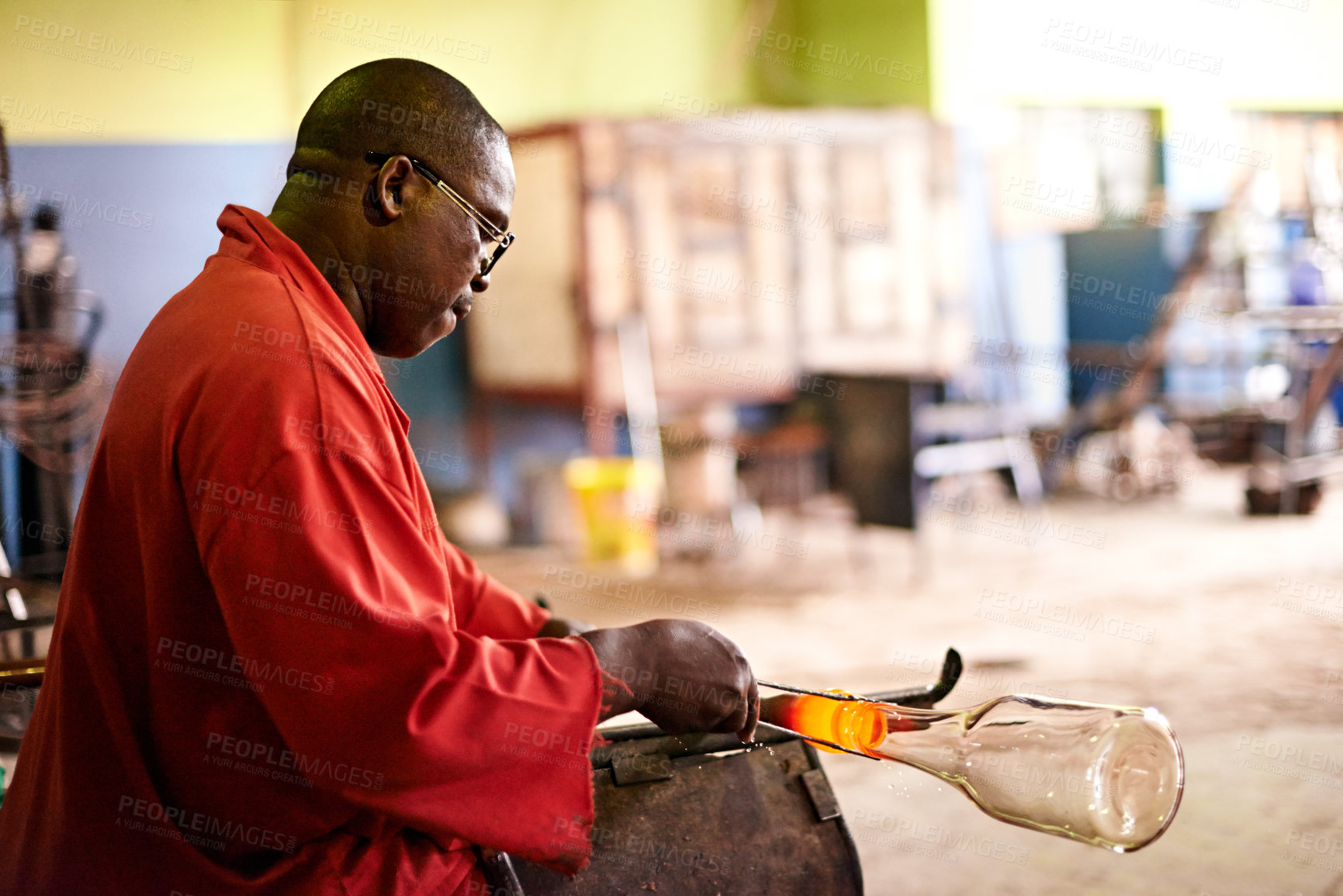 Buy stock photo Glass, blowing and black man in art workshop with small business, craft or handmade technique. Creative, product shape or glassblower in factory for sustainable process, design and sculpture glow