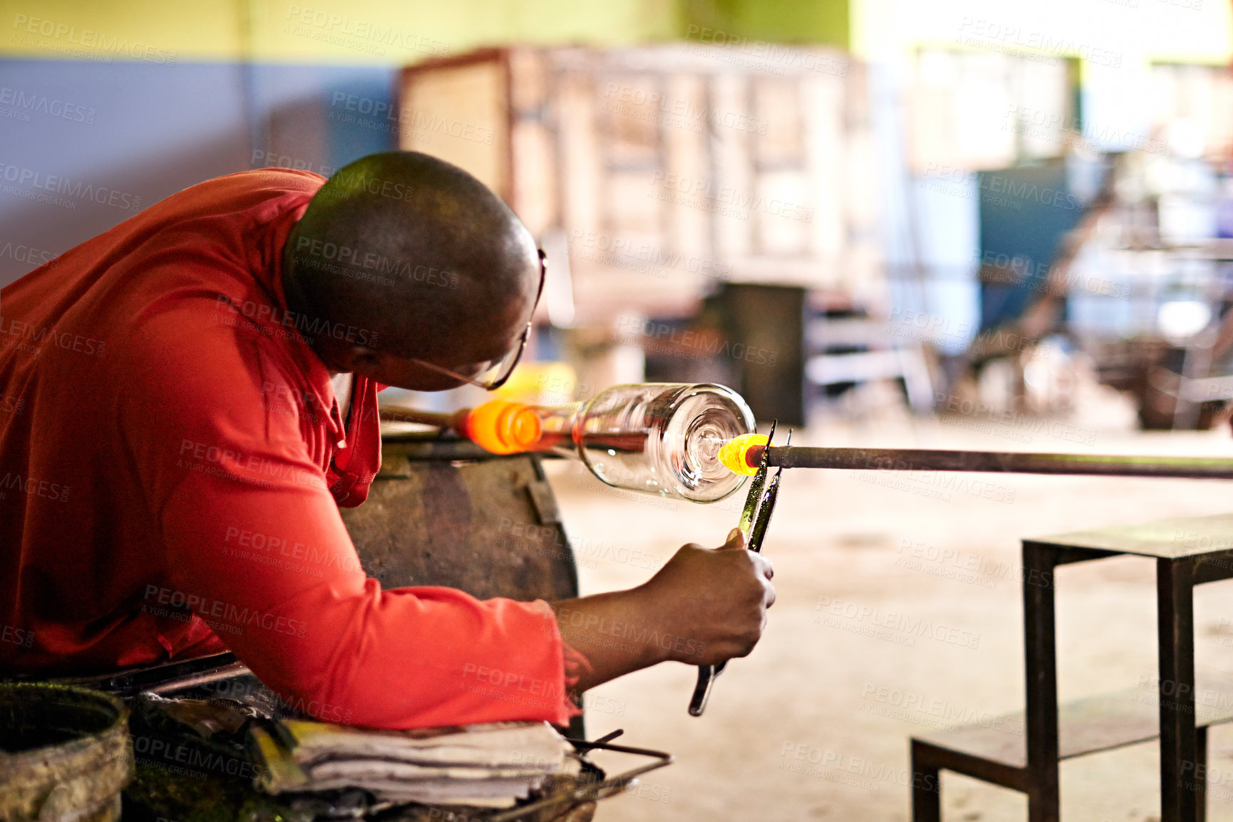 Buy stock photo Glass, blowing and man in creative workshop for small business, craft or handmade technique. Art, product shape and glassblower in factory for sustainable process, bottle design and sculpture tools