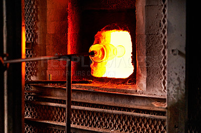 Buy stock photo Furnace, heat and rod for melting glass in forge or foundry to shape industrial material into product. Art, craftsmanship and creative with fire in factory, plant or workshop for manufacturing