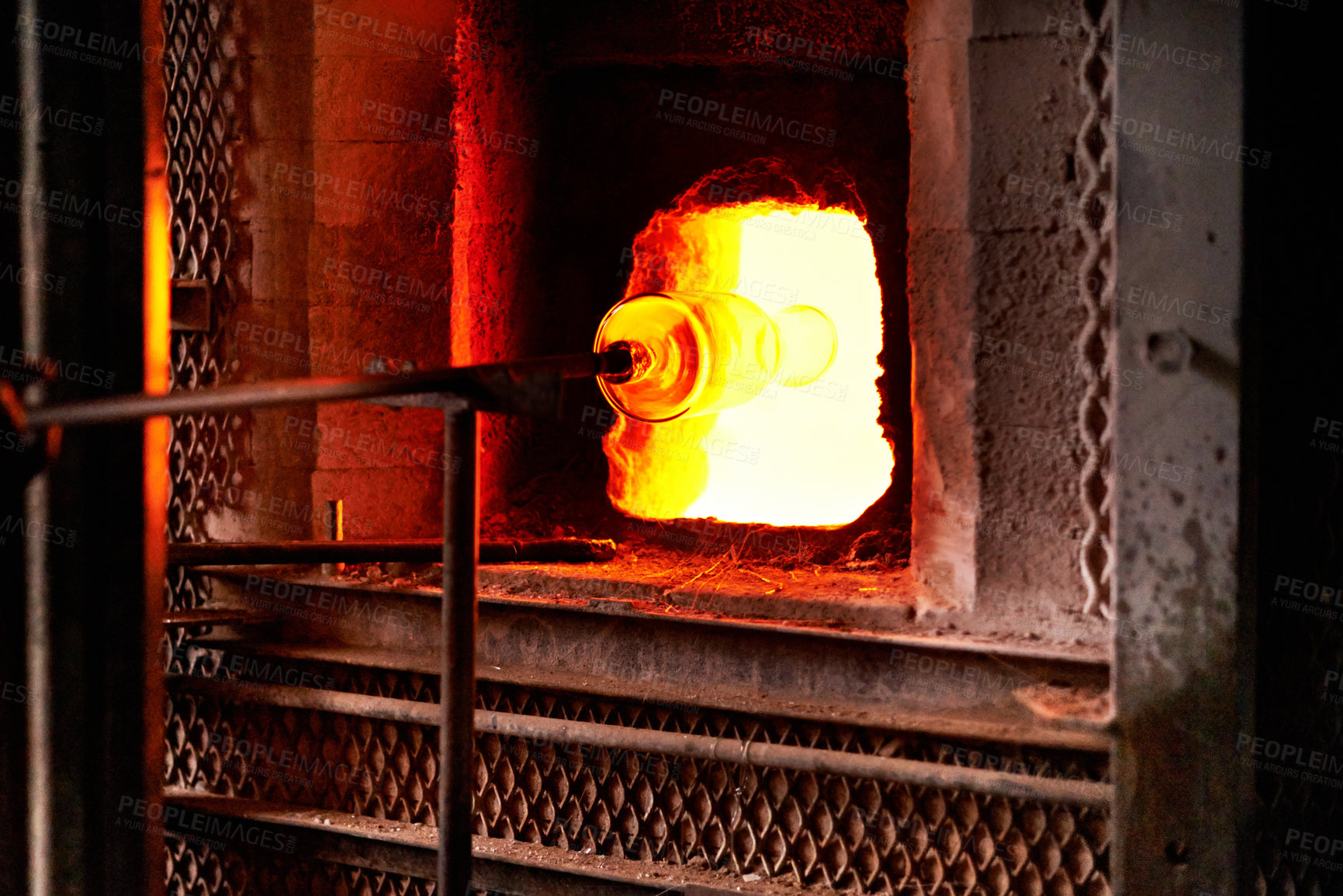 Buy stock photo Furnace, heat and rod for melting glass in forge or foundry to shape industrial material into product. Art, craftsmanship and creative with fire in factory, plant or workshop for manufacturing