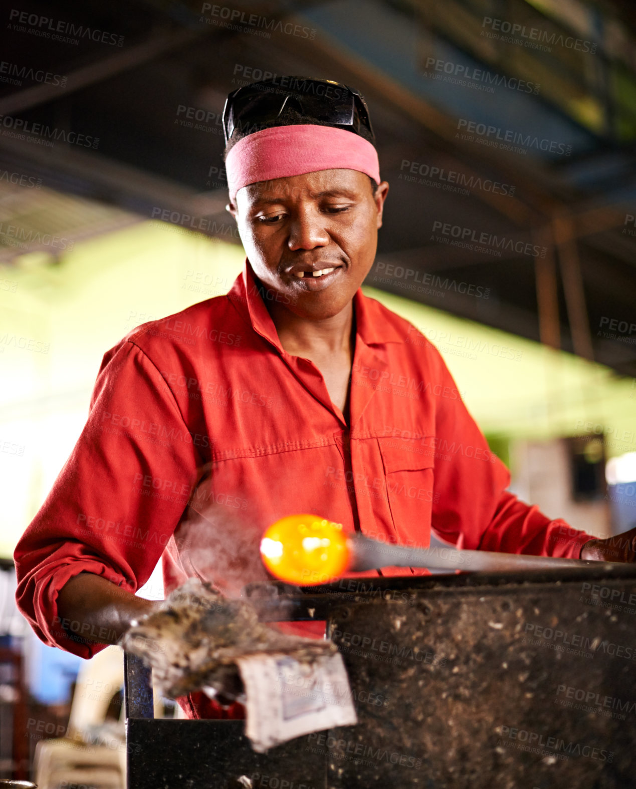 Buy stock photo Glass, blowing and black man in workshop with process, creative small business or handmade form. Art, product shape and glassblower in factory for sustainable craft, design tools and sculpture glow