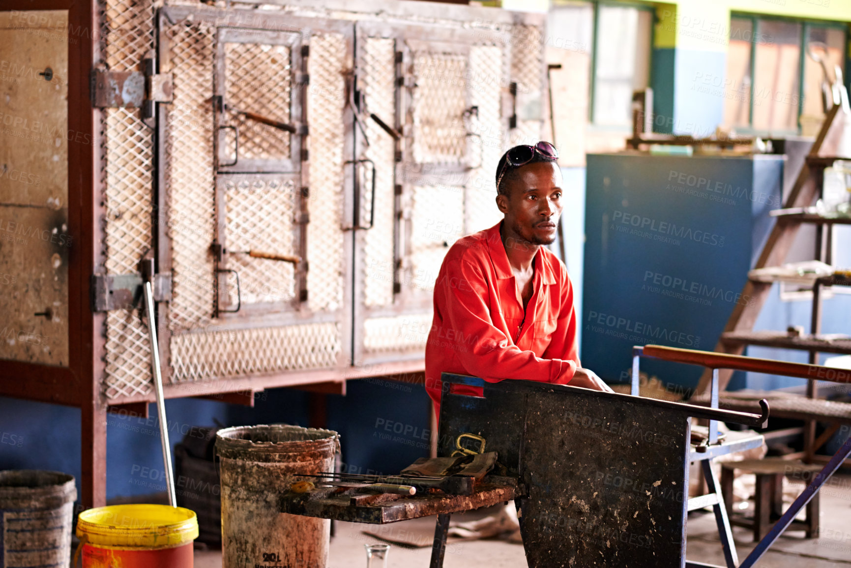 Buy stock photo Break, production and thinking with black man artisan in workshop for industrial manufacturing. Idea, planning and vision with professional blacksmith or craftsman in factory for expert metalwork