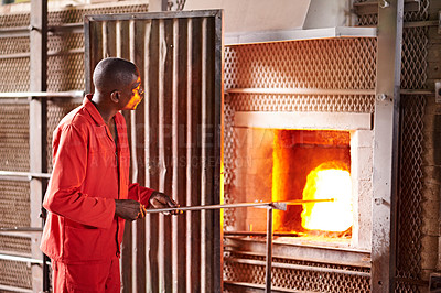 Buy stock photo Furnace, craft and man in workshop with glass for manufacturing windows or products for business. Industry, production and male glassblower with artisan sculpting by fire, heat or flame in factory.