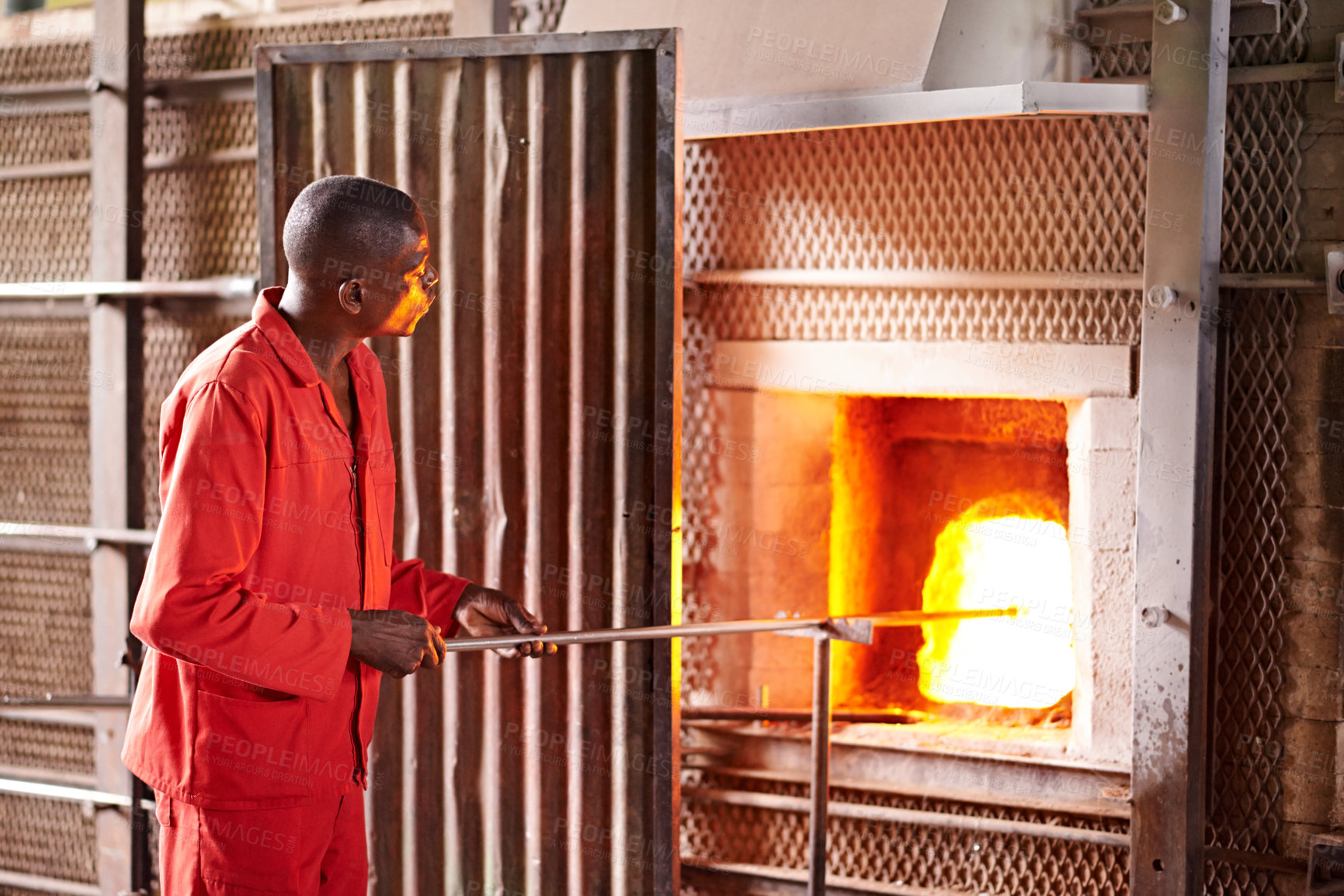 Buy stock photo Furnace, craft and man in workshop with glass for manufacturing windows or products for business. Industry, production and male glassblower with artisan sculpting by fire, heat or flame in factory.