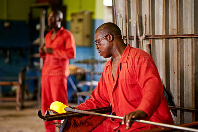 Buy stock photo Glassblowing, working and men with tools, factory and creative for manufacturing of glass and industry. Production, busy and people in uniform for craft, glassmakers and art for design of product