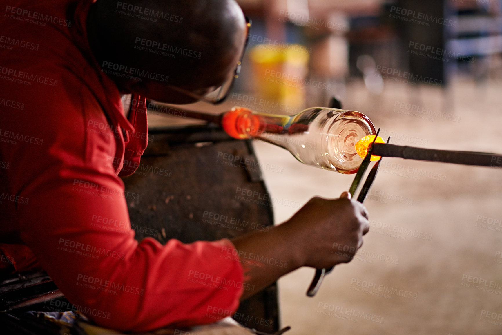Buy stock photo Design, glassblowing and shape with black man artisan in manufacturing or production workshop. Art, creative and process with professional glassblower in factory, forge or plant for craftsmanship