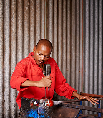 Buy stock photo Glass blowing, artist and black man in workshop for creative small business, craft and handmade shape. Art, product process and glassblower in factory for sustainable project, design and heat tools