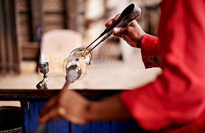 Buy stock photo Glassblowing, hands and tools with artisan person in forge or foundry for manufacturing process. Creative, design and equipment with professional glassblower closeup in factory, plant or workshop