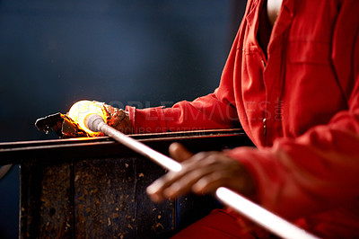 Buy stock photo Hands, glassblower and man with manufacturing, blow pipe and equipment with tools, heat and metal. Person, closeup and employee with material, skills and productivity with industry and craftsmanship
