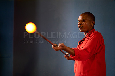 Buy stock photo Labor, manufacturing or production and black man glassblower in forge with molten and rod. Art, creative and glassblowing industry with craftsperson in factory, plant or workshop for handmade process