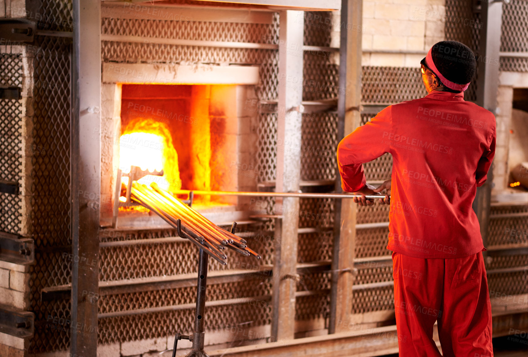 Buy stock photo Furnace, industry and man in workshop with glass for manufacturing windows or products for business. Craft , production and male glassblower with artisan sculpting by fire, heat or flame in factory.