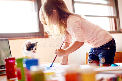 Buy stock photo Cat, painting and girl child in home with fun, education and online tutorial video for art class. Laptop, pet kitten and kid at table with brush, elearning and creative development in apartment