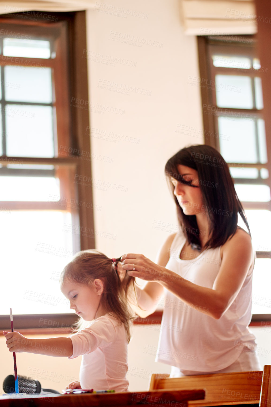 Buy stock photo Morning, child and mother braid hair for school with grooming routine in home with homework. Support, love and mom with girl kid student for hairstyle with education learning for class in house.