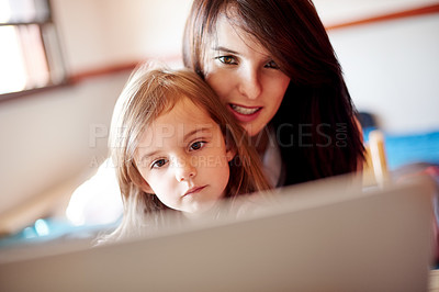 Buy stock photo Woman, kid and relax in home with laptop, memory game app and child development software. Tech, mother and daughter in living room with subscription, streaming media or educational video for learning
