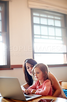 Buy stock photo Laptop, helping and mother with kid in house for elearning app, kindergarten student and creative phonic skills. Child development, teaching and parent control with woman and girl in family home