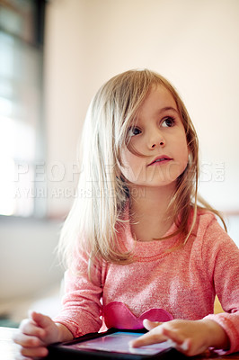 Buy stock photo Kid, student and thinking on tablet in classroom for streaming lesson, elearning and imagination. Child, girl and digital app with online education, ebook website and studying solution for assessment