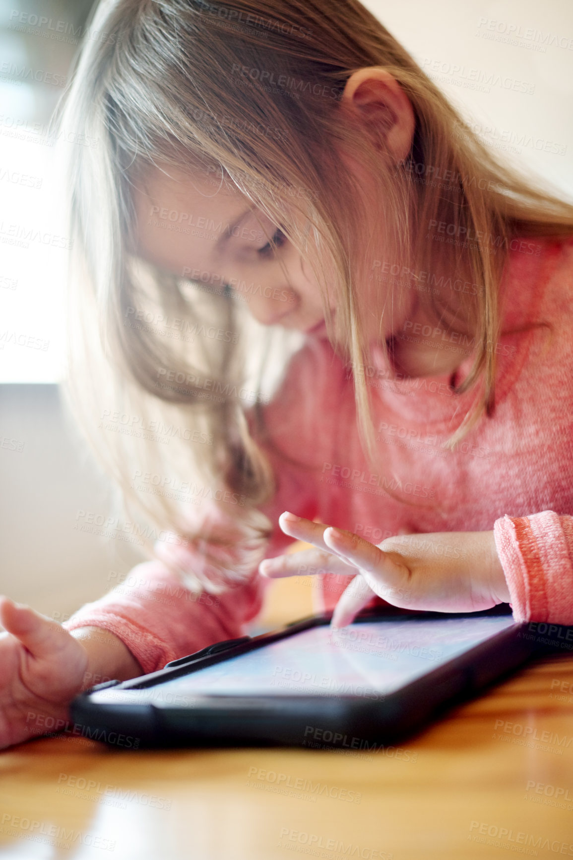 Buy stock photo Kid, student and typing on tablet in classroom for streaming lesson, elearning website and drawing. Child, girl and digital with online education, reading ebook or studying application for assessment