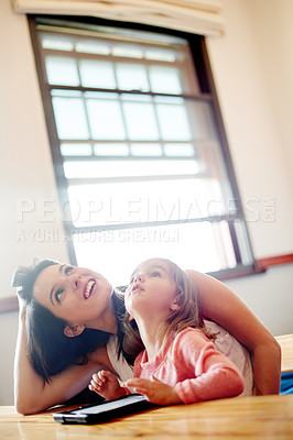 Buy stock photo Tablet, teaching and mother with kid in living room for elearning app, kindergarten student and creative phonic skills. Child development, search and parent control with woman and girl in family home