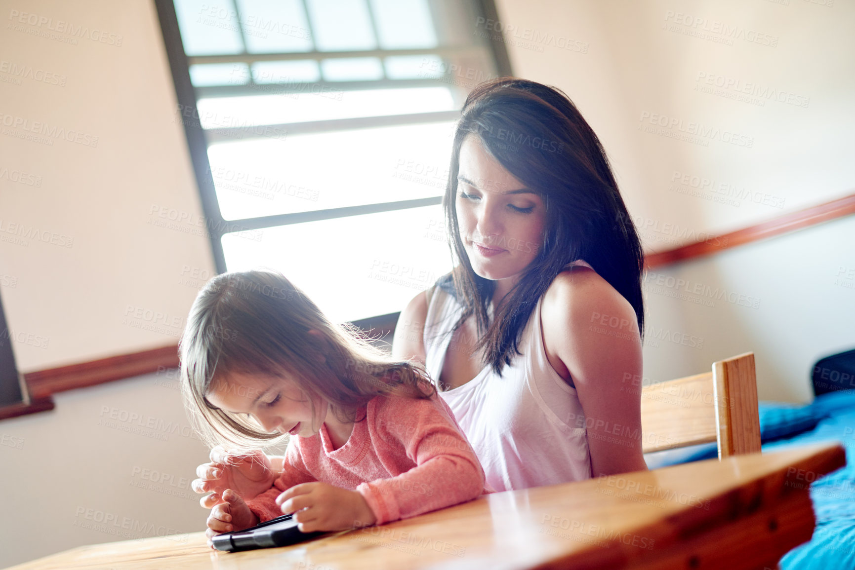 Buy stock photo Mother, girl and relax with tablet in home for online movie, watching educational cartoon and bonding. Woman, child and digital tech for streaming subscription, playing games and learning app search