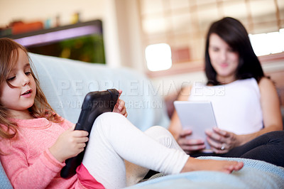Buy stock photo Tablet, relax and mother with kid in living room for elearning app, kindergarten student and creative phonic skills. Child development, teaching and parent control with woman and girl in family home