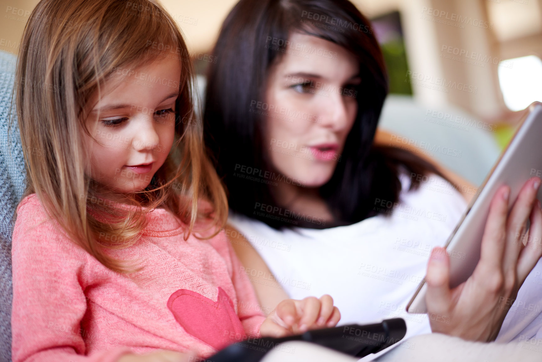 Buy stock photo Tablet, relax and mother with kid on sofa in living room for interactive learning app for development. Education, bonding and mom with girl child on digital technology for online brain games in home.
