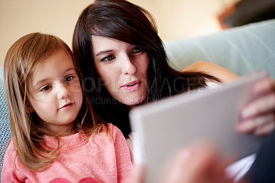 Buy stock photo Tablet, relax and mother with child in living room on sofa for interactive learning app for development. Education, bonding and mom with girl kid on digital technology for online brain games in home.