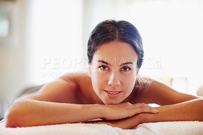 Buy stock photo Happy woman, portrait and relax with spa day for beauty, physical therapy or body treatment at resort. Face, female person and lying with smile on massage bed for salon getaway, stress relief or zen