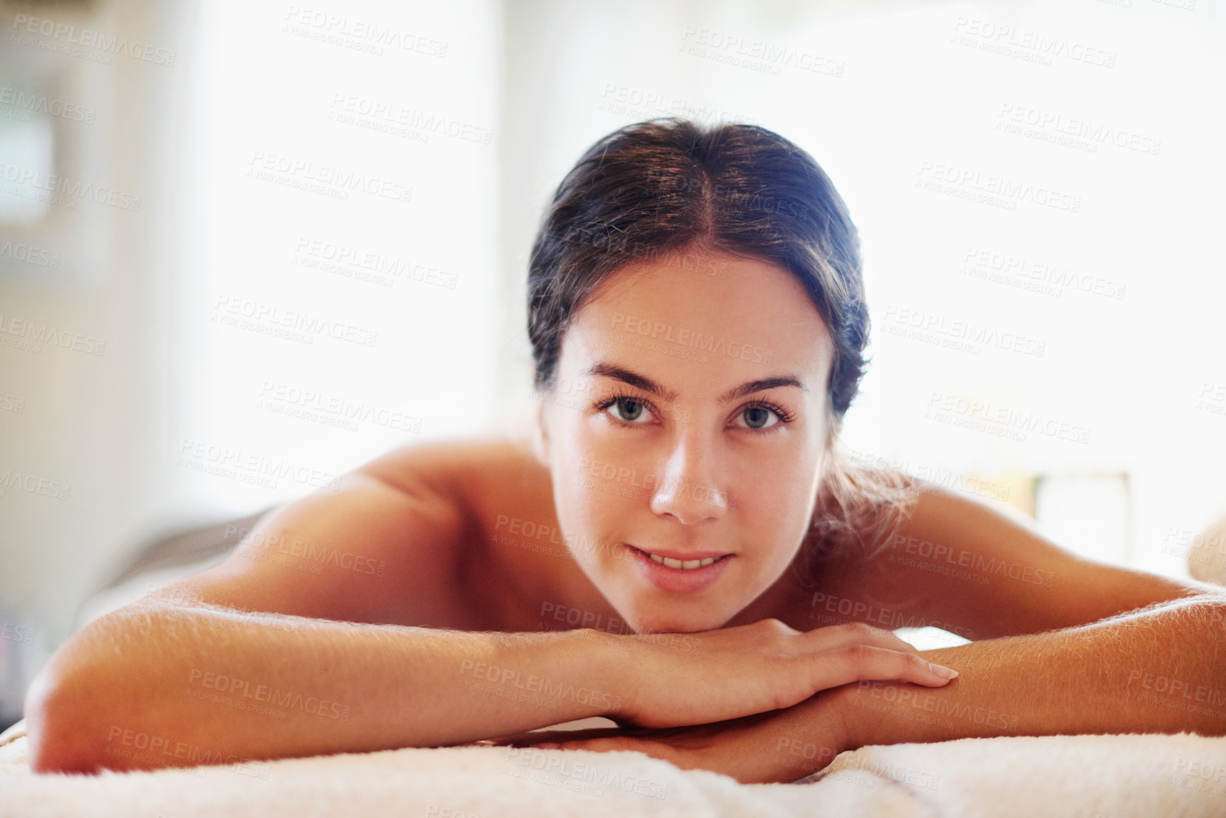 Buy stock photo Happy woman, portrait and relax with spa day for beauty, physical therapy or body treatment at resort. Face, female person and lying with smile on massage bed for salon getaway, stress relief or zen