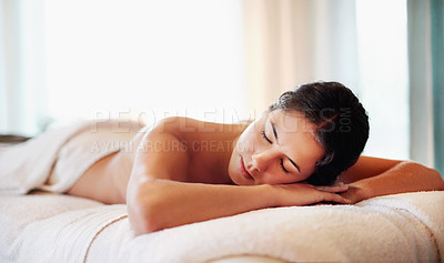 Buy stock photo Relax, spa and woman on table for back massage in beauty salon for detox therapy, treatment and wellness. Luxury resort, cosmetics and calm person resting for health, stress relief and satisfaction