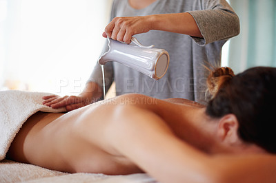 Buy stock photo Massage, oil and woman at spa with therapist for hospitality, natural peace and zen with luxury hotel service. Relax, masseuse and client on table at wellness clinic for holistic self care treatment.