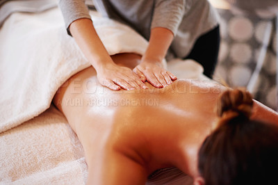 Buy stock photo Woman, hands and masseuse with back massage at spa for beauty, physical therapy or body treatment at resort. Female person, lying and relaxation on bed at luxury salon for gentle rub or stress relief